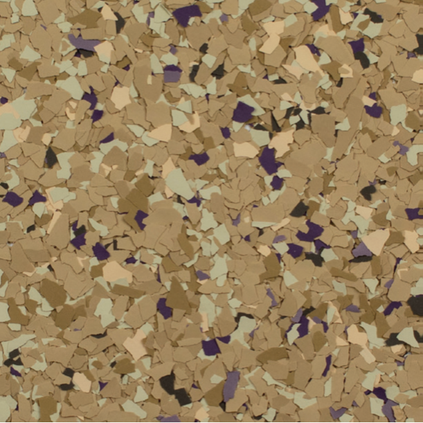 Close-up of a speckled floor coating in tan, light green, and dark purple.