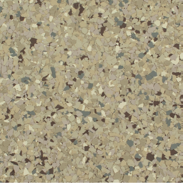 Close-up of speckled flooring with tan, brown, and gray chips.