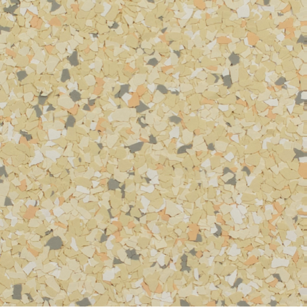 Terrazzo flooring with beige, peach, grey, and white chips.