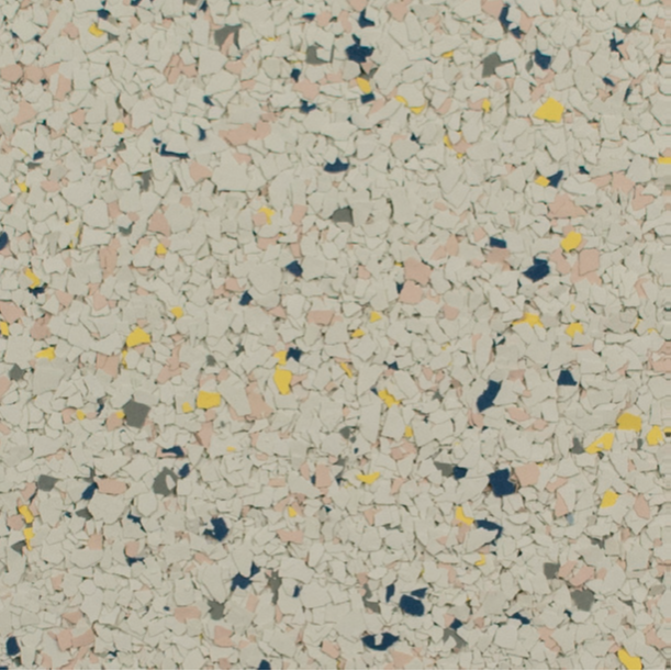 Terrazzo-style flooring with flecks of pink, yellow, blue, and gray on a light gray background.