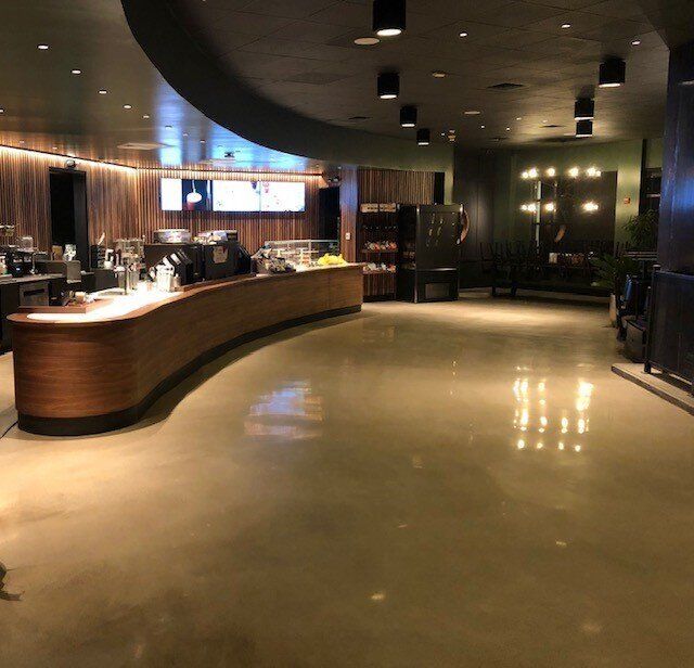 A large room with a long curved counter in the middle