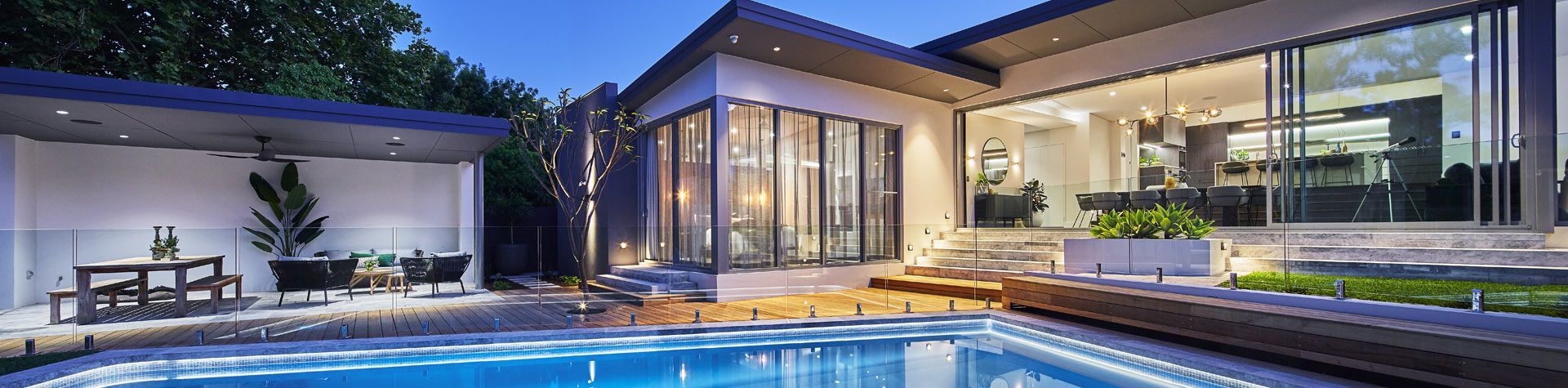 A swimming pool with a screened in area surrounding it.