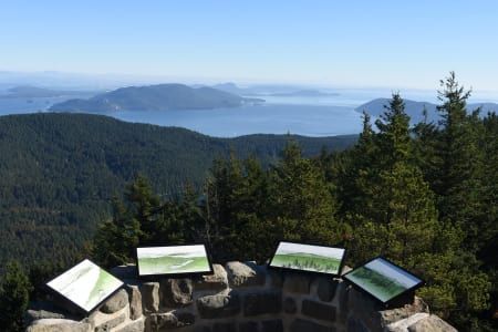 A view of a lake from the top of a mountain