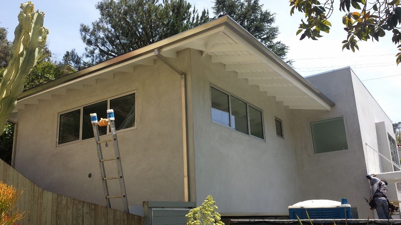 worker installing a gutter