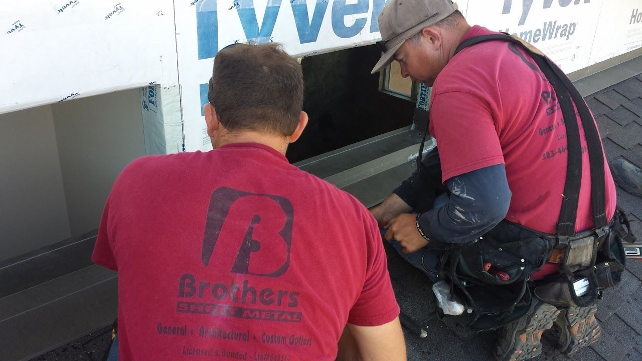 worker installing a gutter