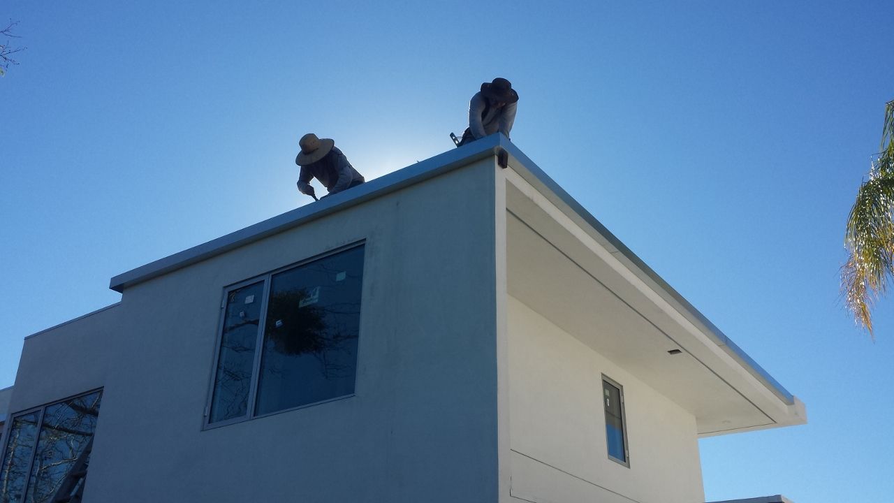 worker installing a gutter
