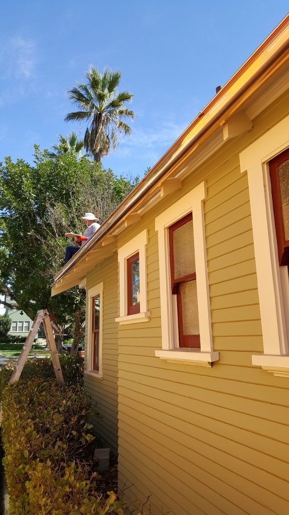 worker installing a gutter