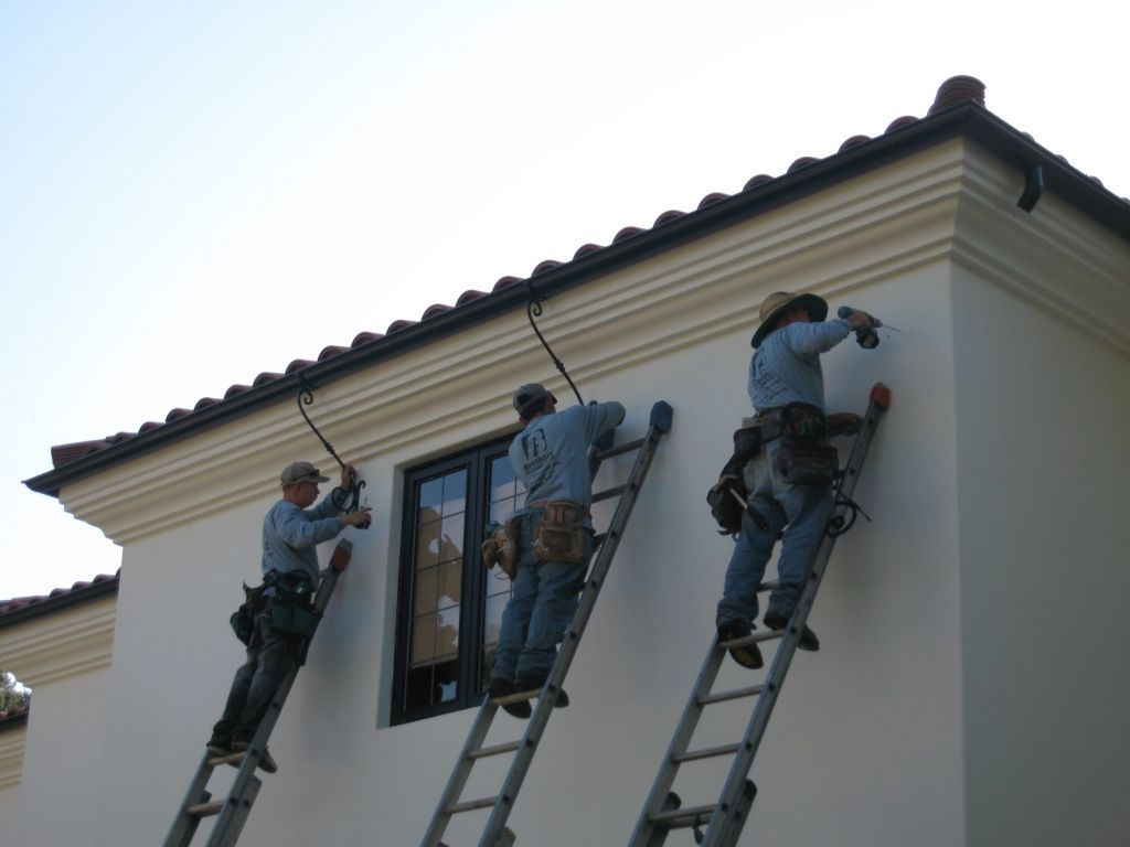 worker installing a gutter