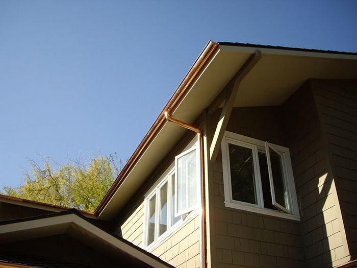 worker installing a gutter