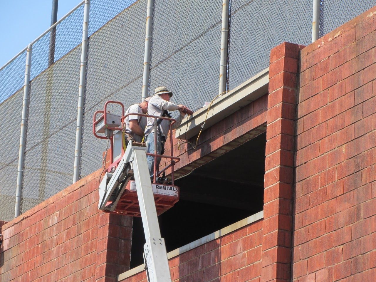 worker installing a gutter