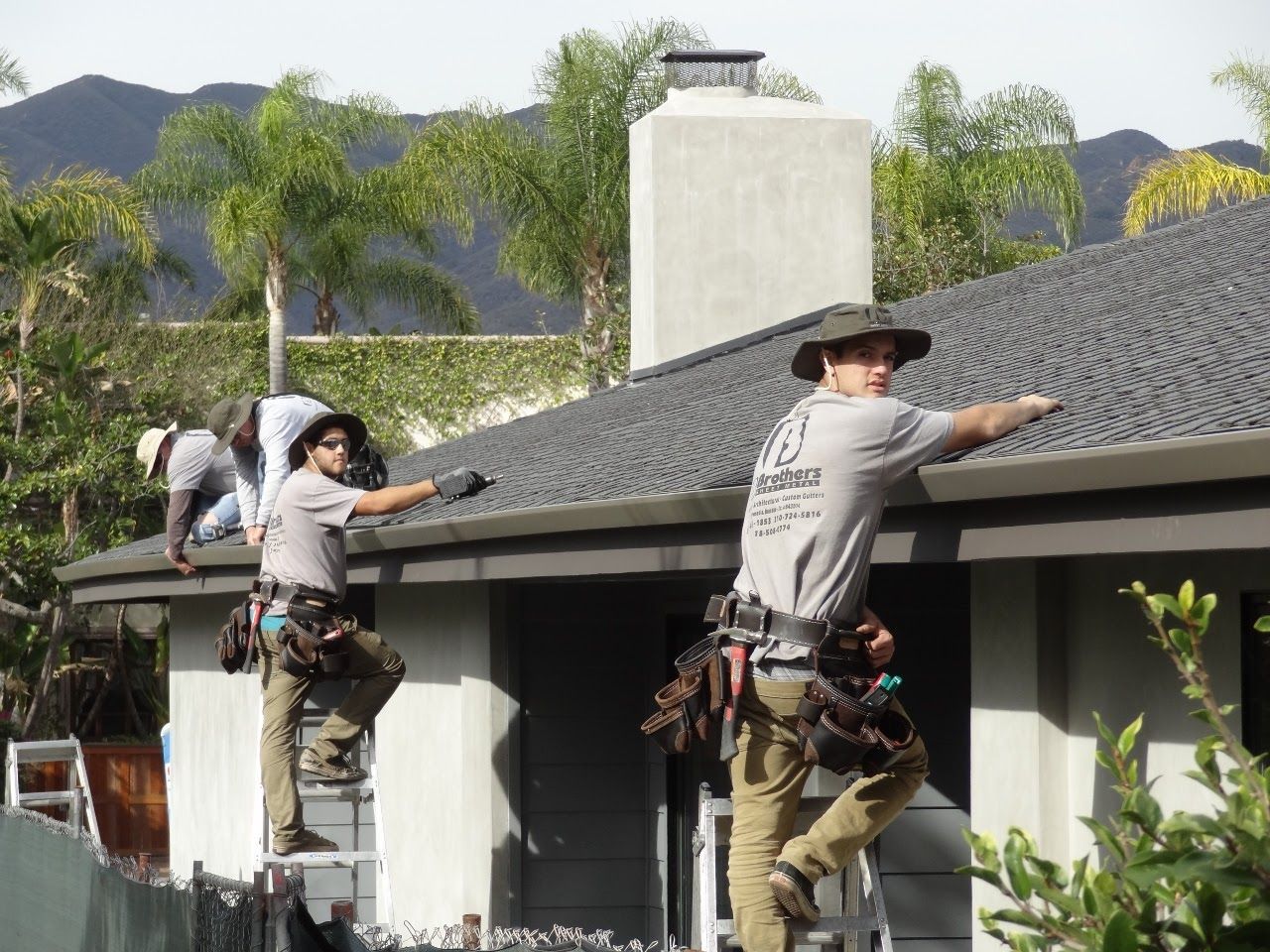 worker installing a gutter