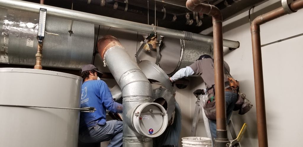 worker installing a gutter