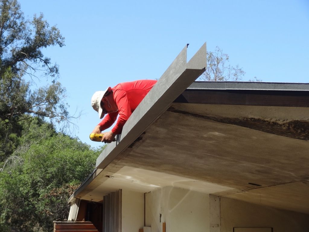 worker installing a gutter