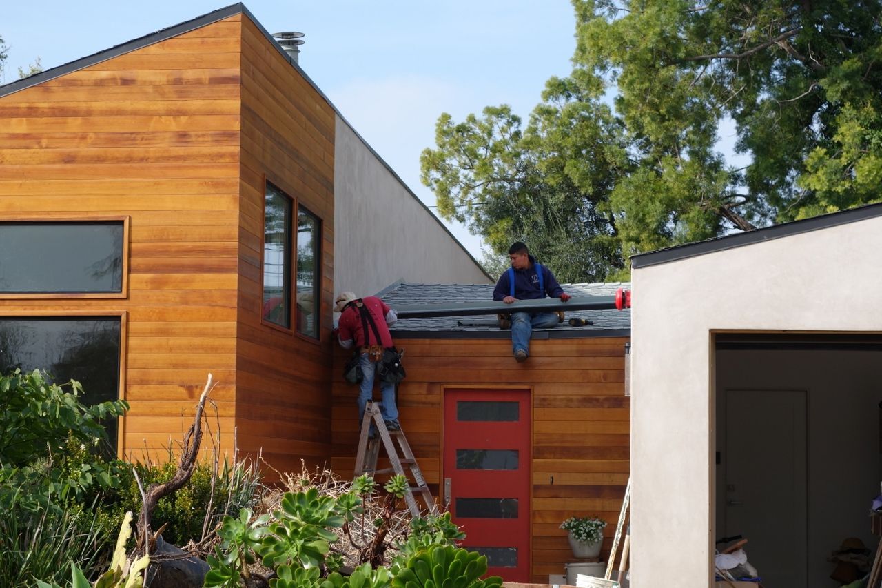worker installing a gutter