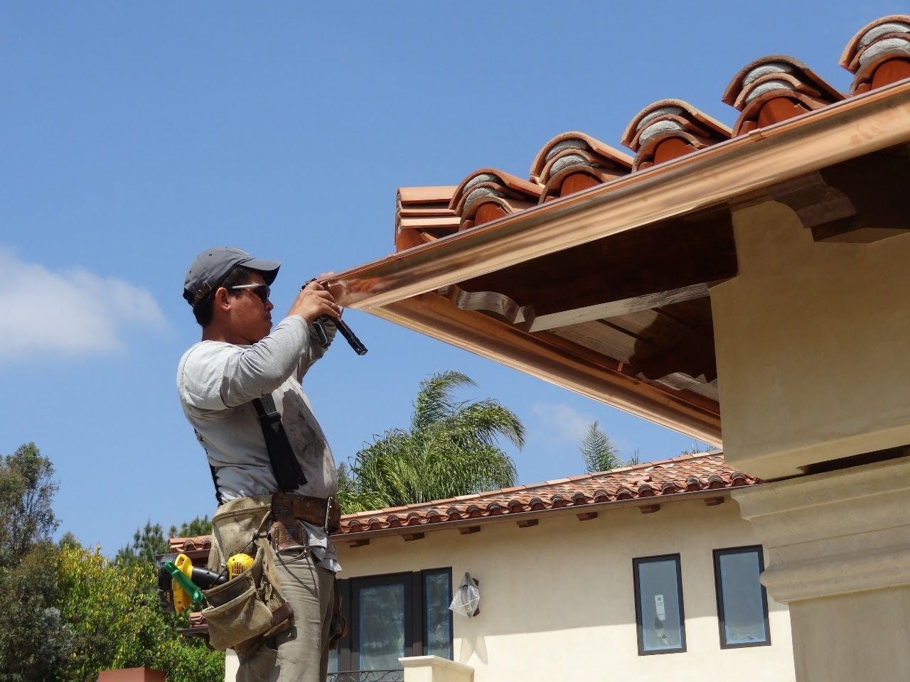 worker installing a gutter