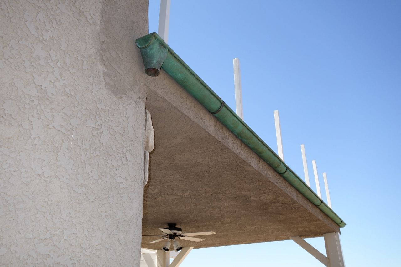 worker installing a gutter
