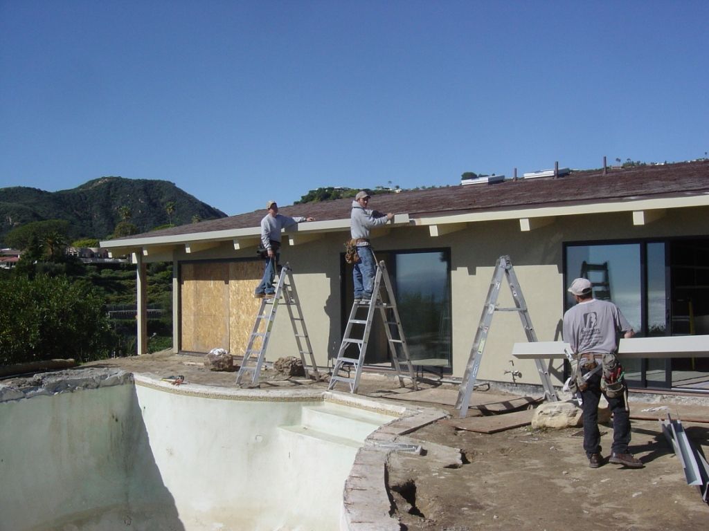 worker installing a gutter