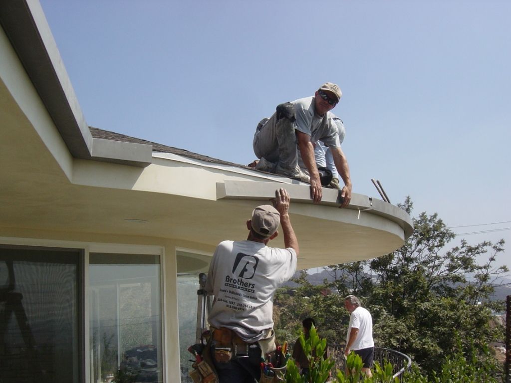 worker installing a gutter
