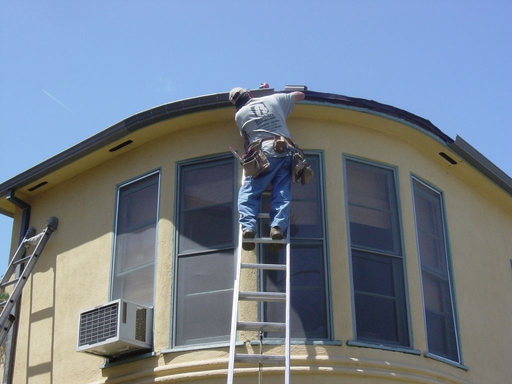 worker installing a gutter