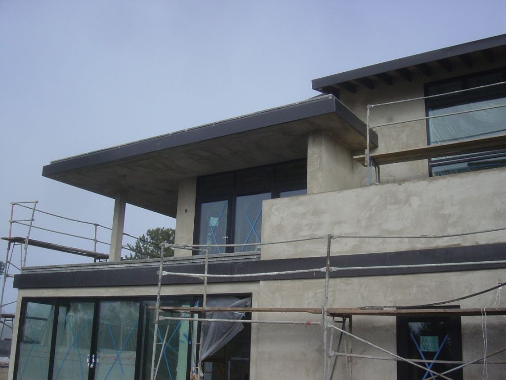 worker installing a gutter