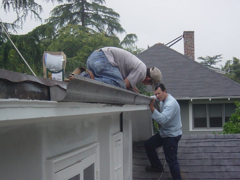 worker installing a gutter