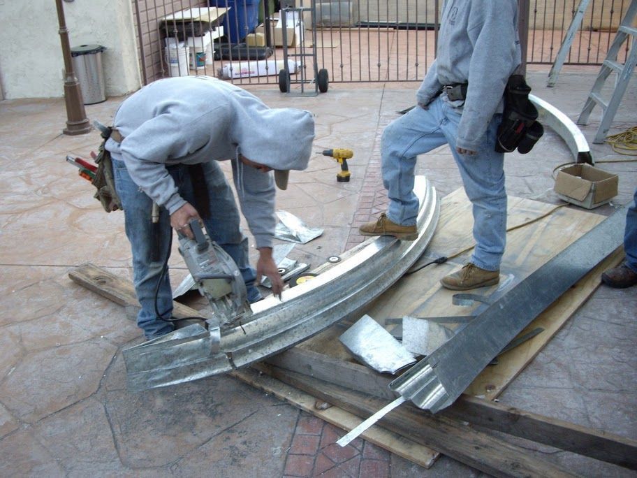 worker installing a gutter