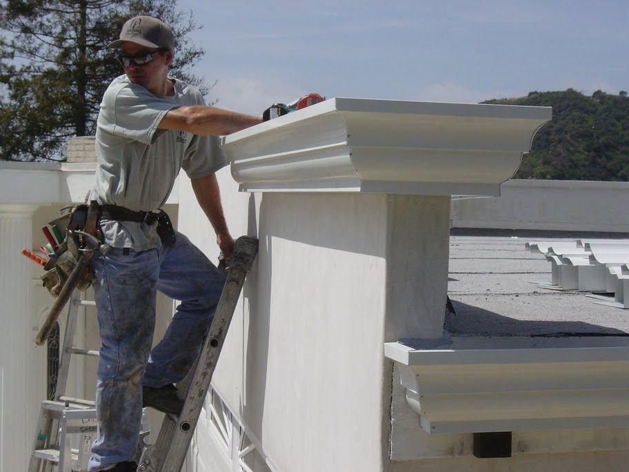 worker installing a gutter