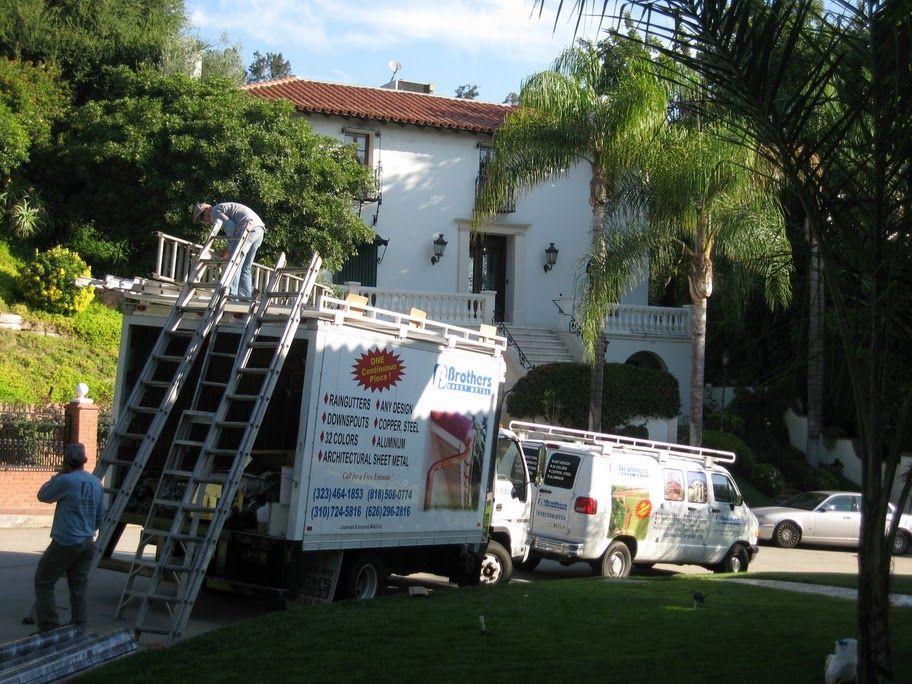 worker installing a gutter