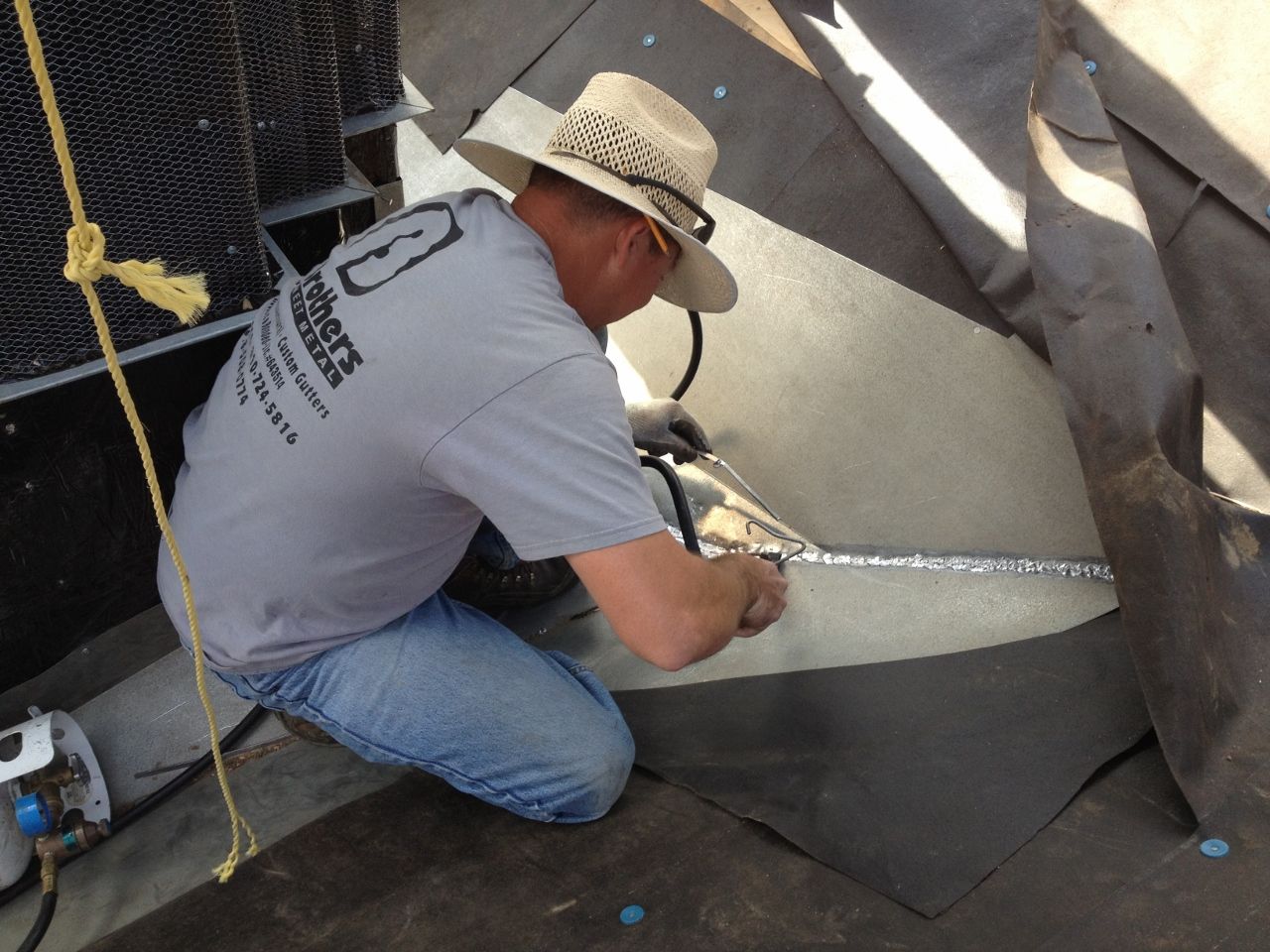 worker installing a gutter