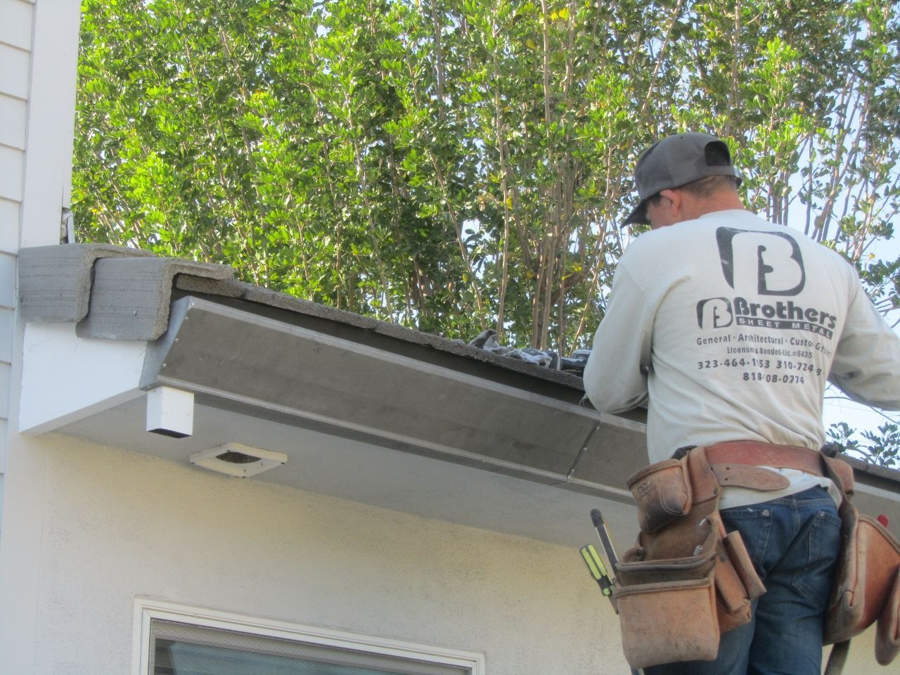 worker installing a gutter