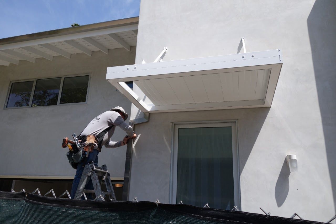 worker installing a gutter