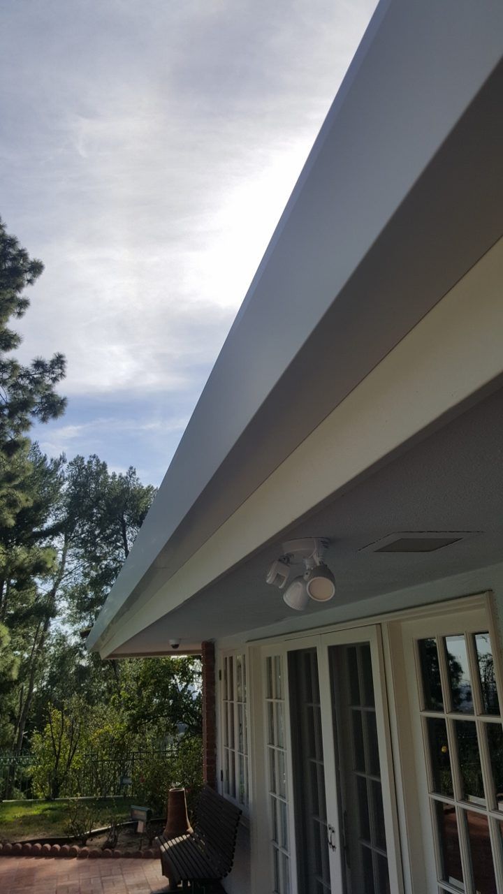 worker installing a gutter
