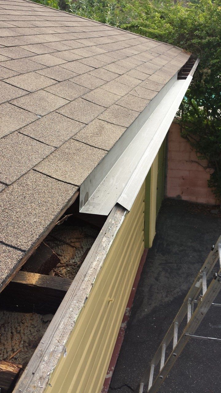 worker installing a gutter