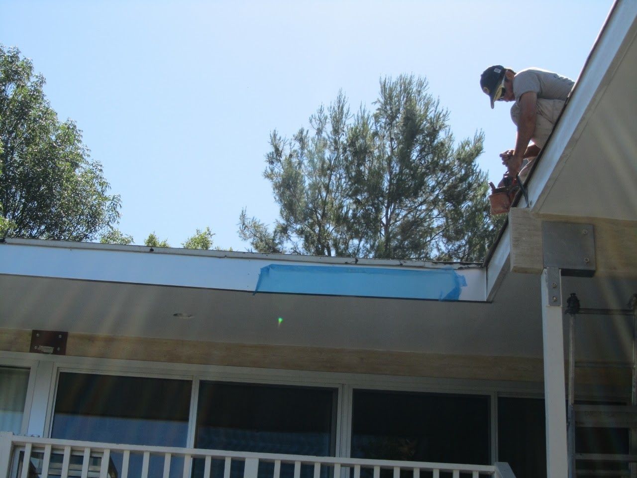 worker installing a gutter
