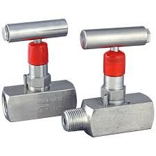 A pair of stainless steel valves with red caps on a white background.