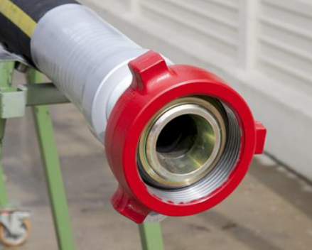 A close up of a hose with a red cap on it