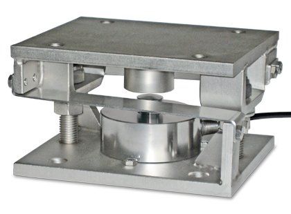 A stainless steel machine is sitting on a white surface