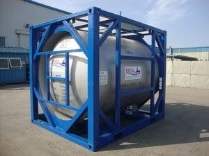 A large stainless steel tank is in a blue crate.