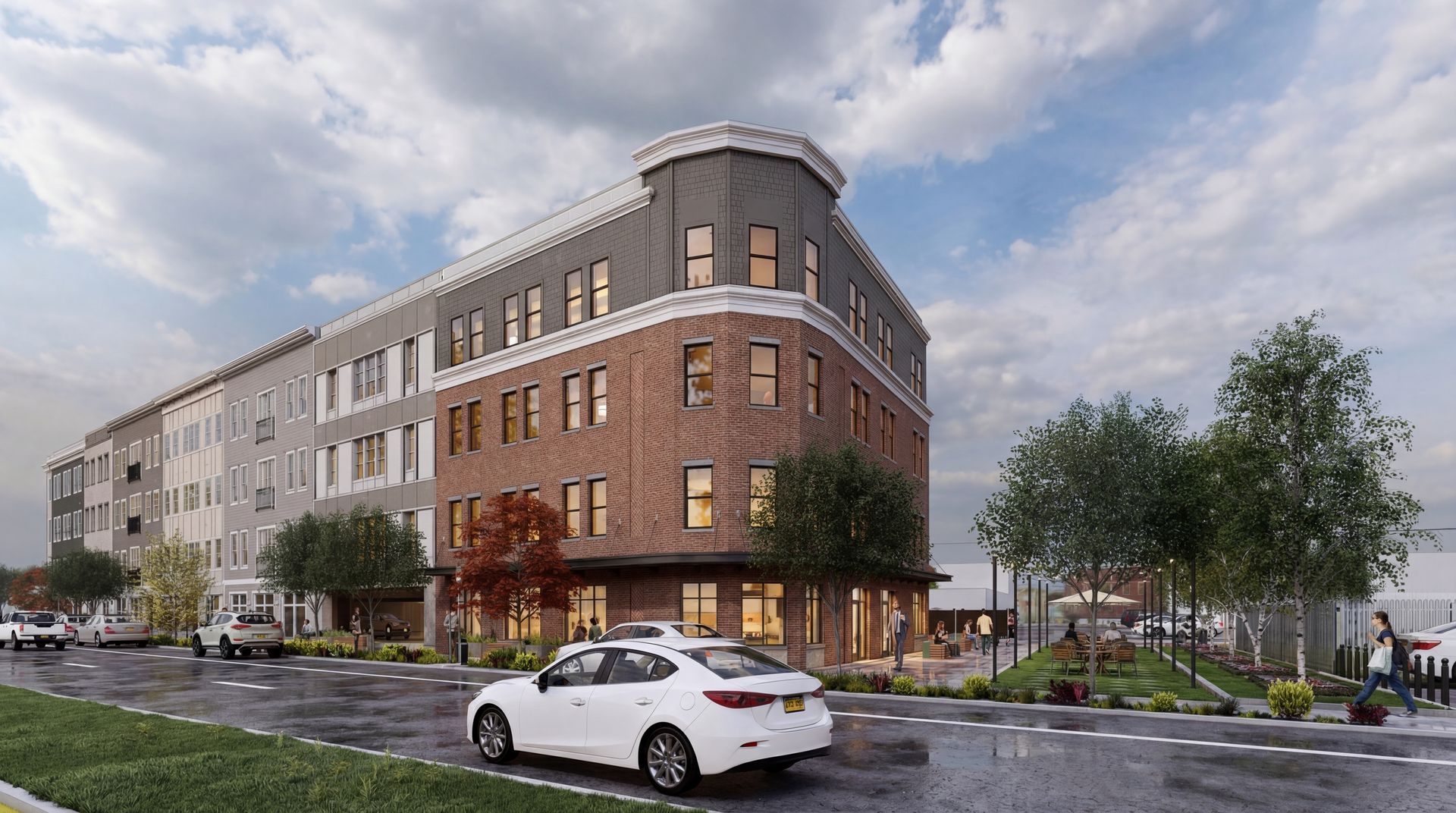 A digital rendering of a multi-story brick and grey apartment building on a city street corner with a white car.