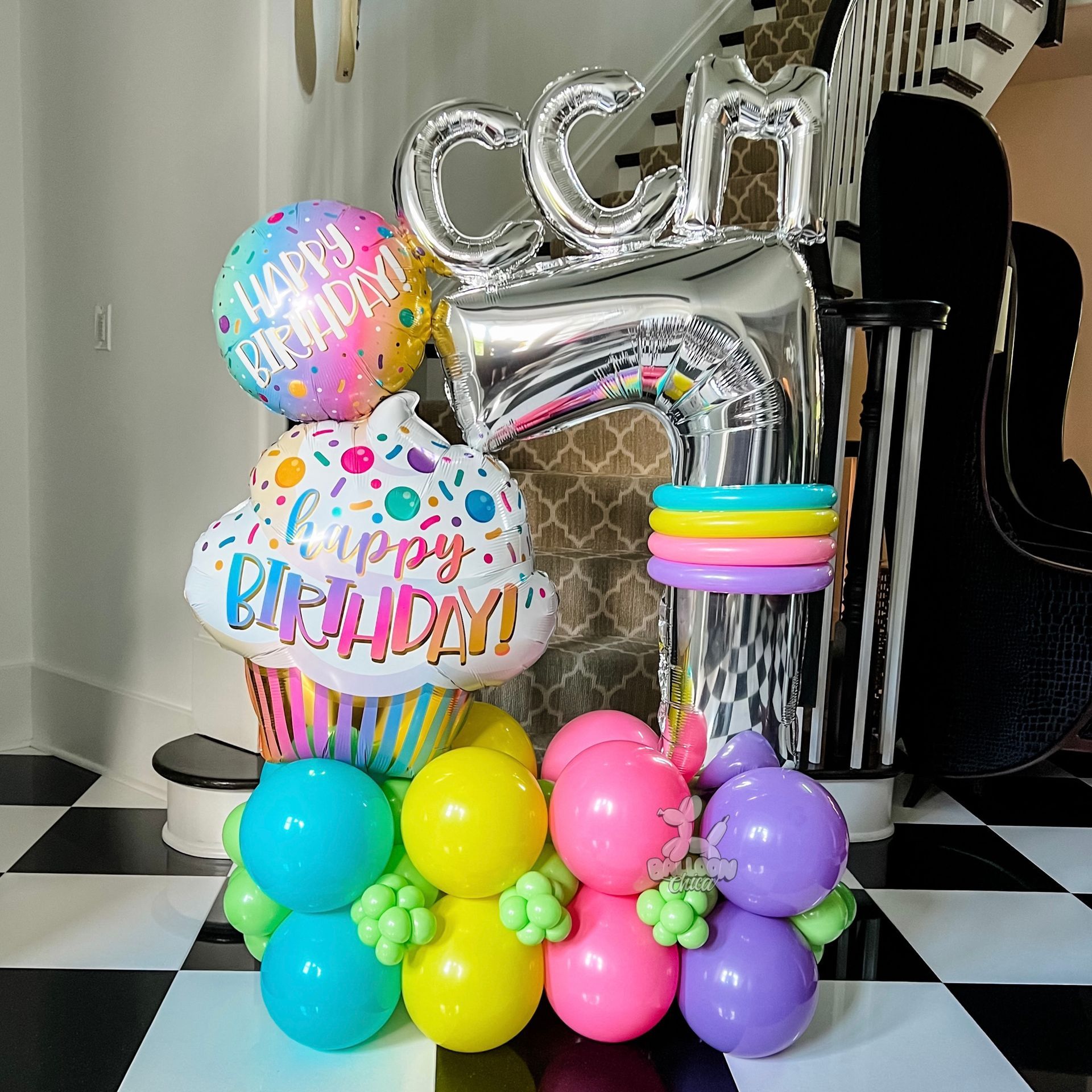 a bunch of balloons with the name emillie on them