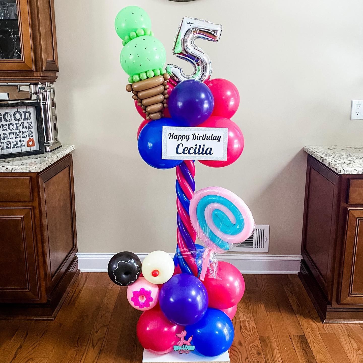 a bunch of balloons with the number 5 on it