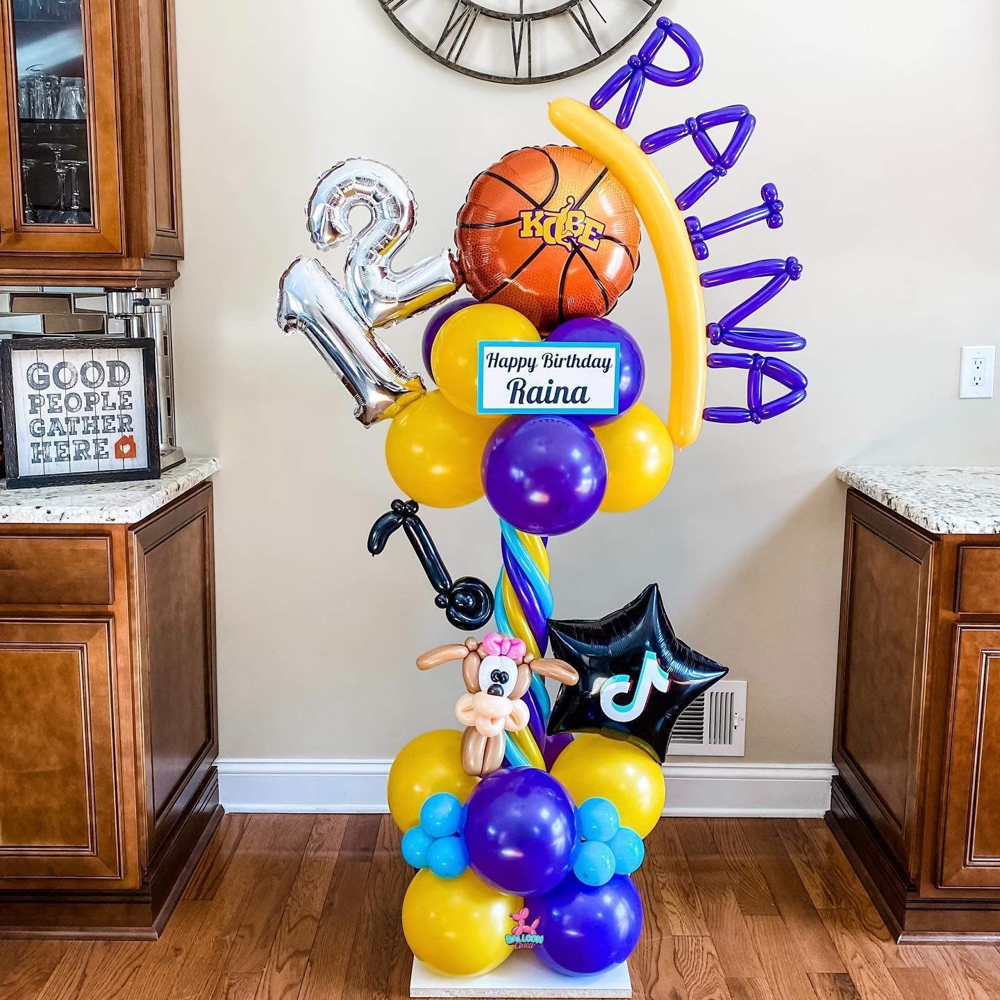 a bunch of balloons with the name raina on them