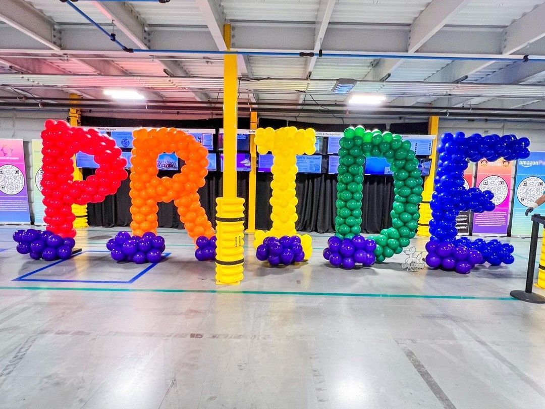 the word pride is made out of balloons in a building