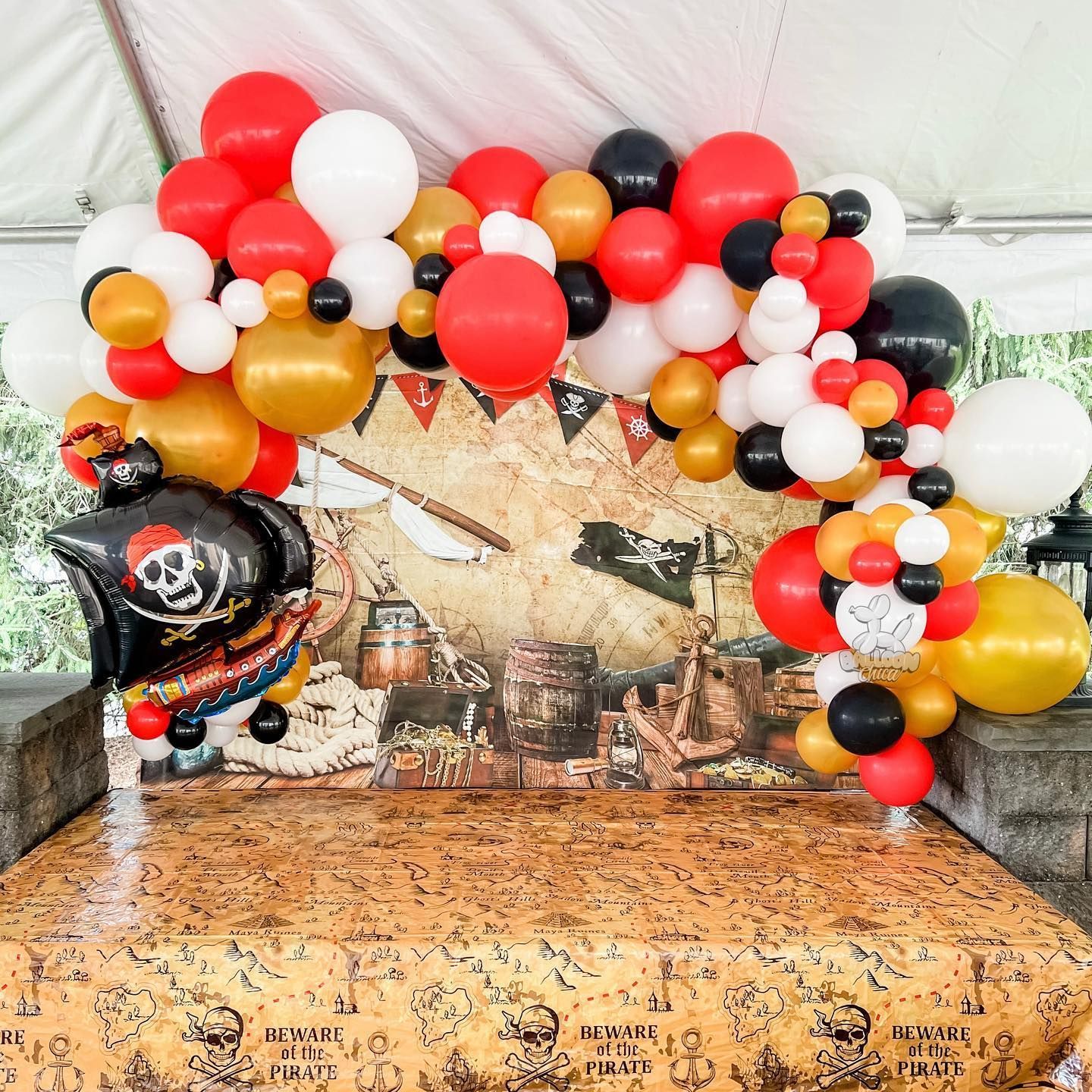 a bunch of balloons are sitting on top of a table .