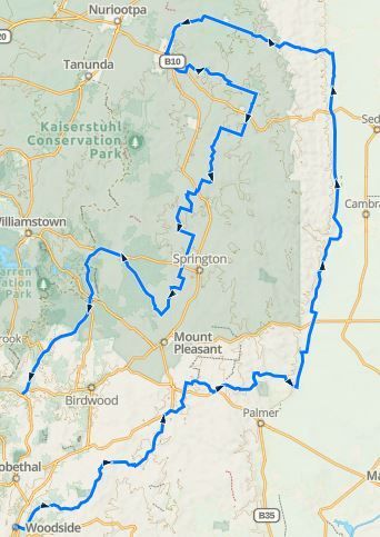 Blue route line tracing a large loop on a map around Palo Alto and nearby towns in California