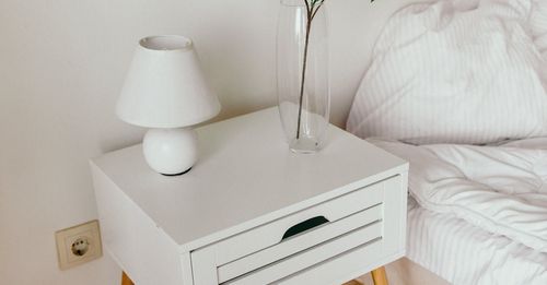 A tidy nightstand and bedside