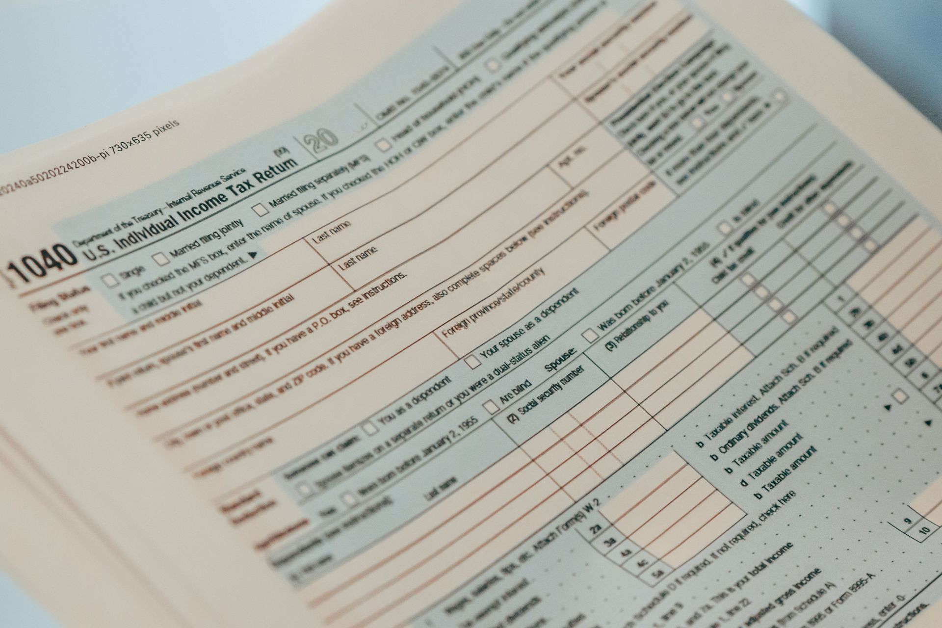 Close-up of a partially filled-out 1040 U.S. Individual Income Tax Return form.
