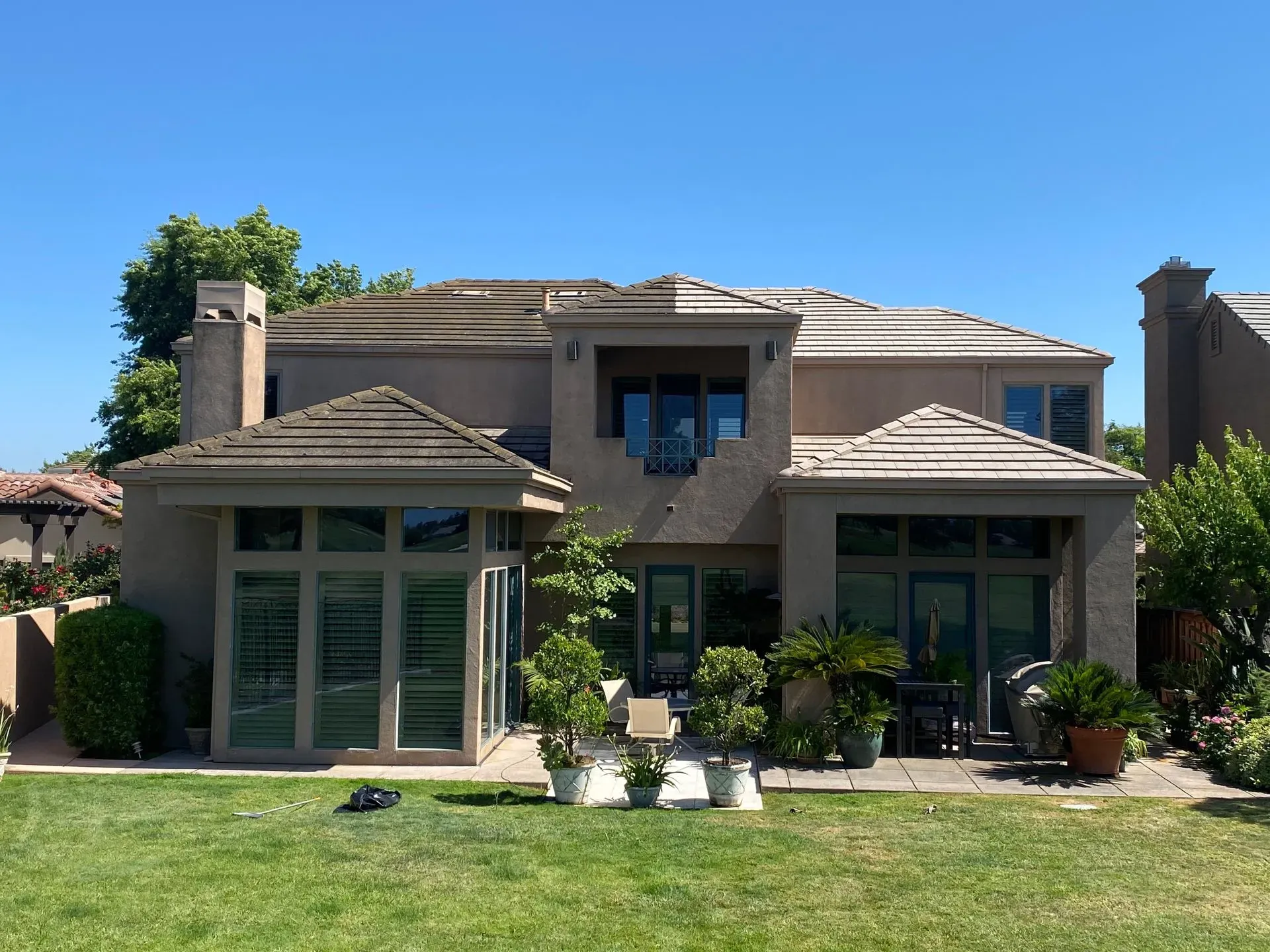 A large house with a lawn in front of it