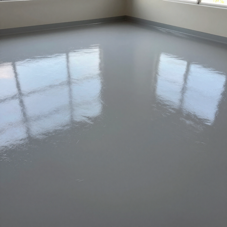 Empty room with a glossy gray floor reflecting two windows.
