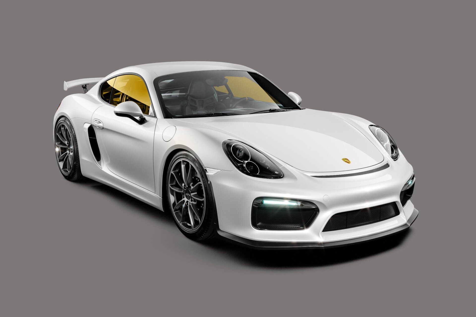 White Porsche sports car on a gray background; features black wheels and yellow-tinted windows.